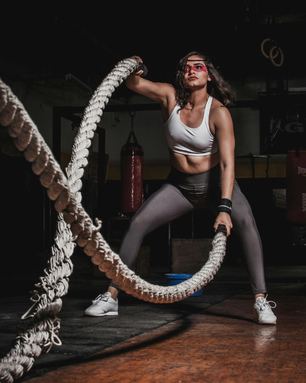 Athlete training with battle ropes