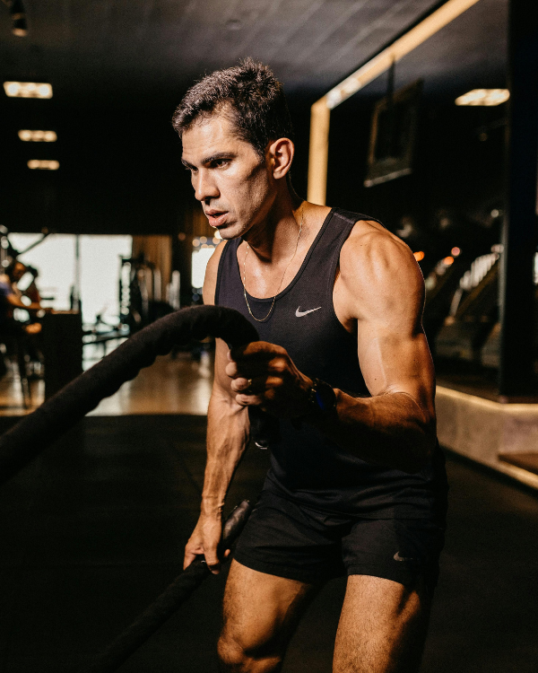 Athlete training with battle ropes